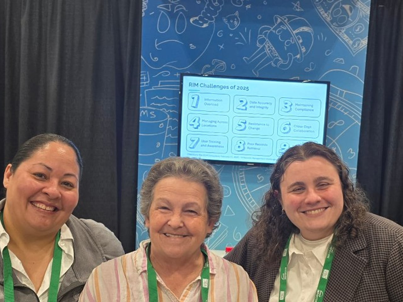Feith team members with an ARMA colleague at a records management event
