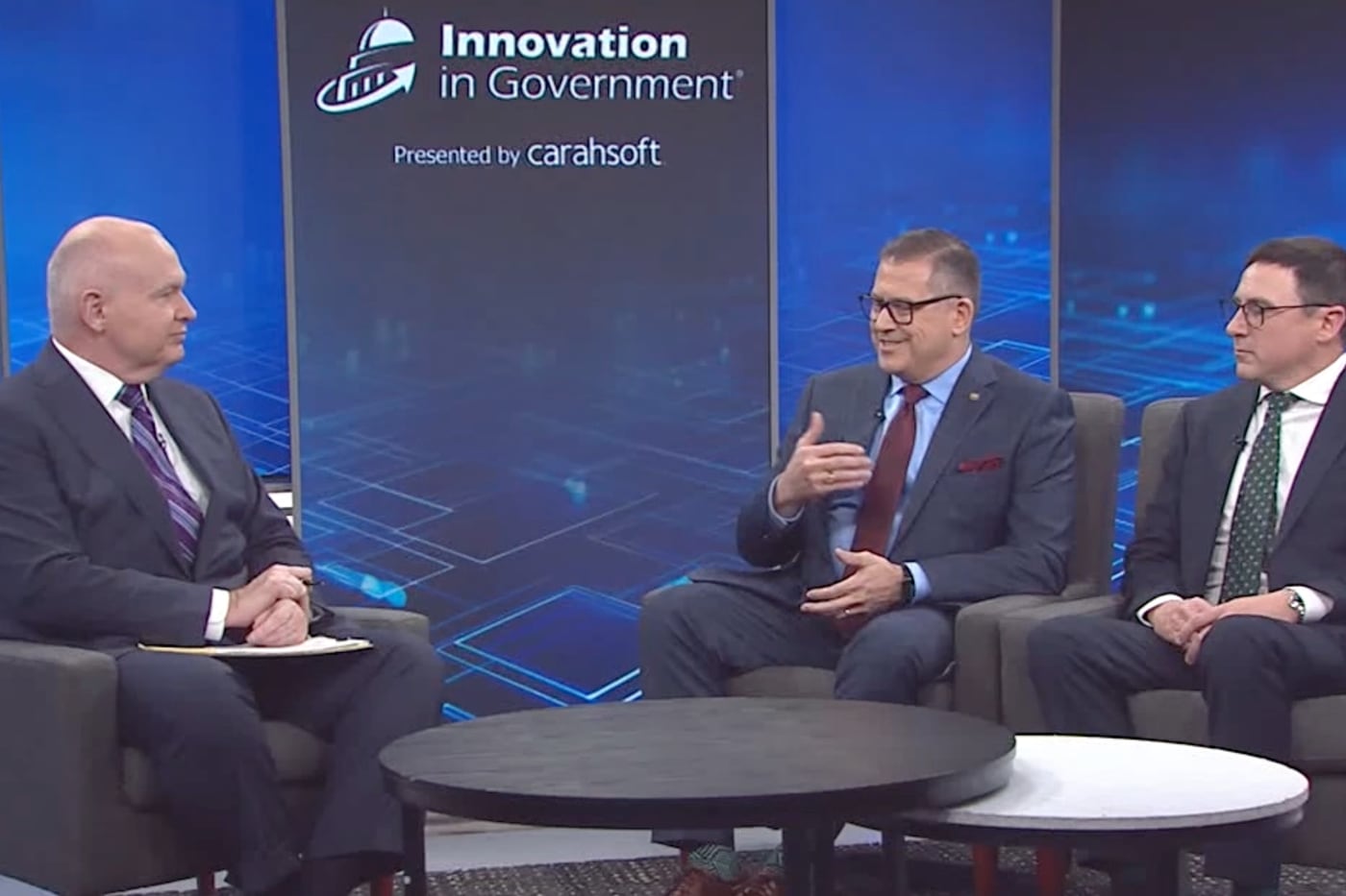 Feith leadership in a seated panel discussion at the Innovation in Government broadcast set